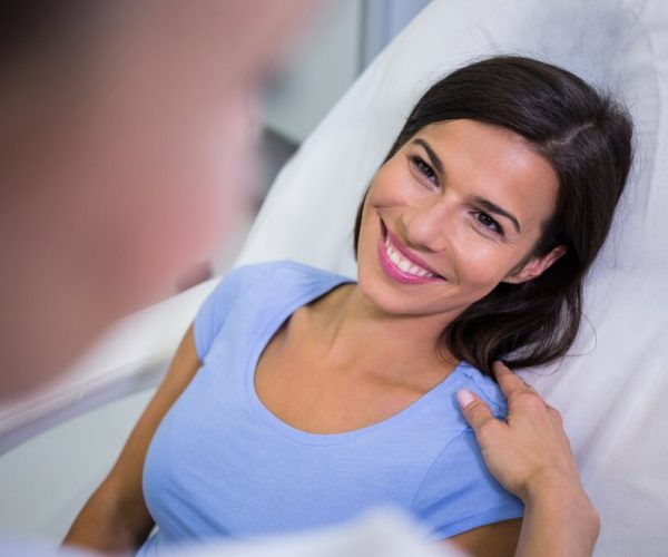 female-patient-smiling-while-talking-doctor_107420-73983 female-patient-smiling-while-talking-doctor_107420-73983